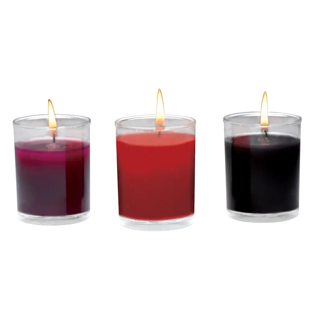 Master Series Flame Drippers Candle Set: lit scented candles in purple, red, and black wax