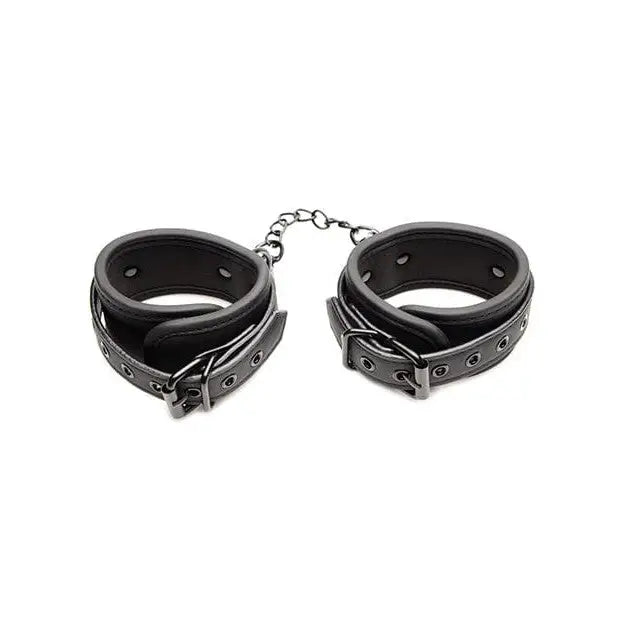 Pair of black leather ankle cuff set connected by a chain from the Master Series collection