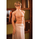 A man in a towel stands beside a mirror with NextGen Dolls Kenny Premium Love Doll