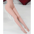 A woman lays on a bed with crossed legs, showcasing the NextGen Dolls - Tall Fantasy Love Doll Waist Down