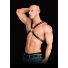 Muscular shirtless man in Ouch! Adonis High Halter Body Harness and jeans