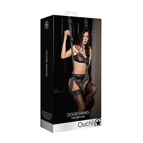 A woman wearing lingerie uses the Ouch! Door Swing with thigh supports and an open box nearby