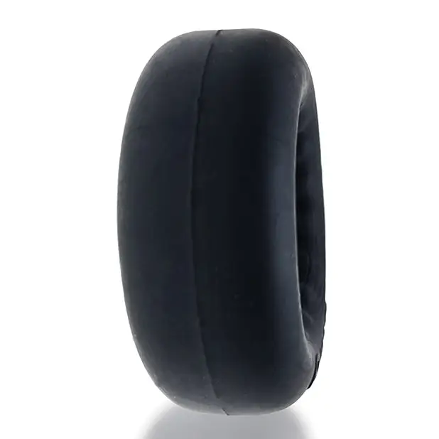 Black rubber tire on white background – Oxballs Axis Rib Griphold Cockring Clear Ice plus+silicone