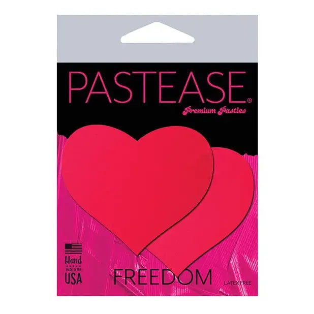 Heart-shaped red nipple pasties ’Pastease Freedom’ on pink packaging for Pastease Basic Heart Black