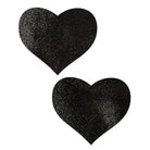 Two black glitter heart shaped stickers from the Pastease Basic Liquid Heart collection