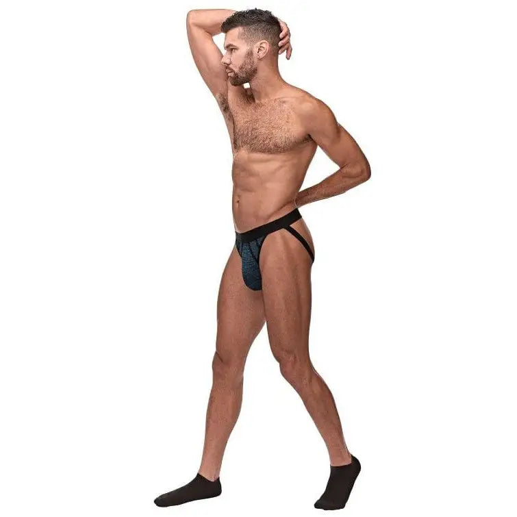 Muscular shirtless man modeling Peak Performance Sport Jock in underwear and socks