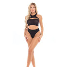 Woman in black cut-out swimsuit by Rene Rofe, wearing the ’Divine’ high waist thong