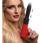 Woman holding Pistola Pounder thrusting vibrator, a red and black vibrating sex toy