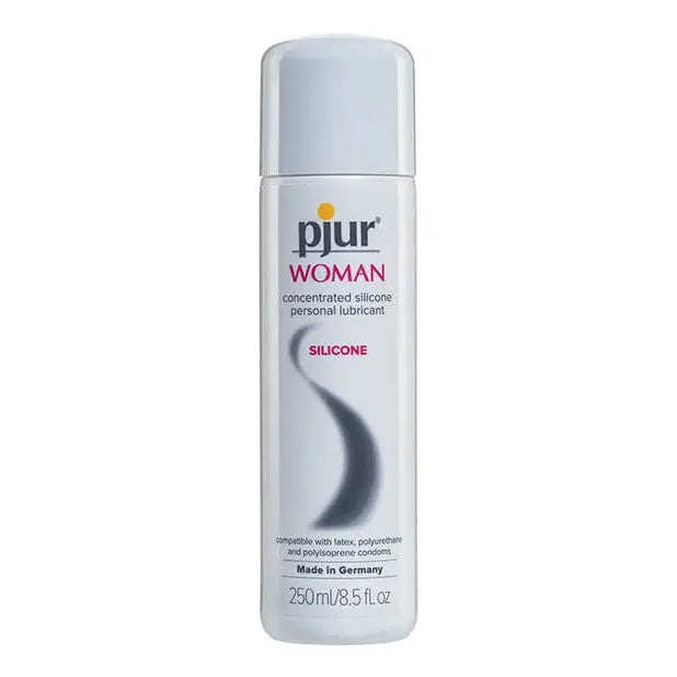 A bottle of pjur WOMAN SILICONE lubricant for women displayed with pure woman deodil