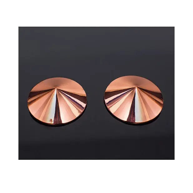 Pair of copper-colored Pleasure Collection Metal Pasties by Coquette