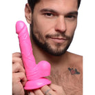 Bright pink Pop Peckers 6.5’ Dildo with Balls, featuring a sturdy suction cup base