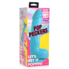 Turquoise silicone dildo with suction cup base in colorful Pop Peckers packaging