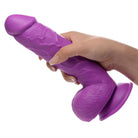 Purple silicone dildo with textured surface and suction cup base; Pop Peckers 8.25’ with balls