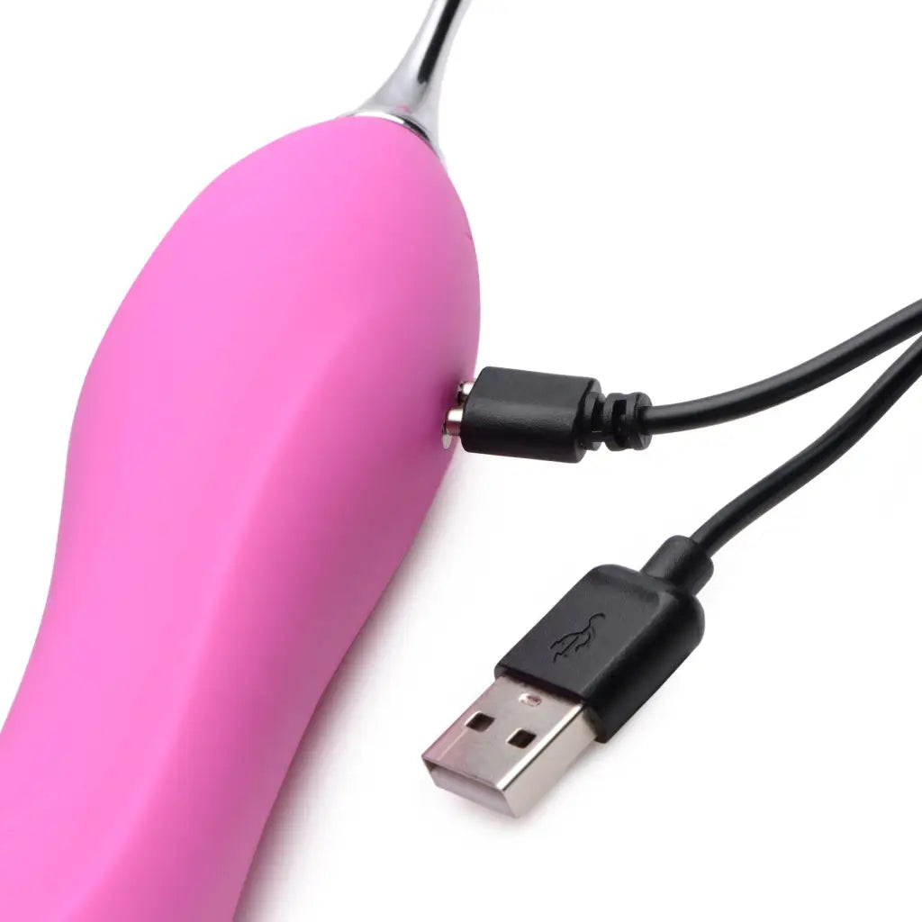 Power Zinger Dual Ended Vibrator in pink with USB charging cable attached