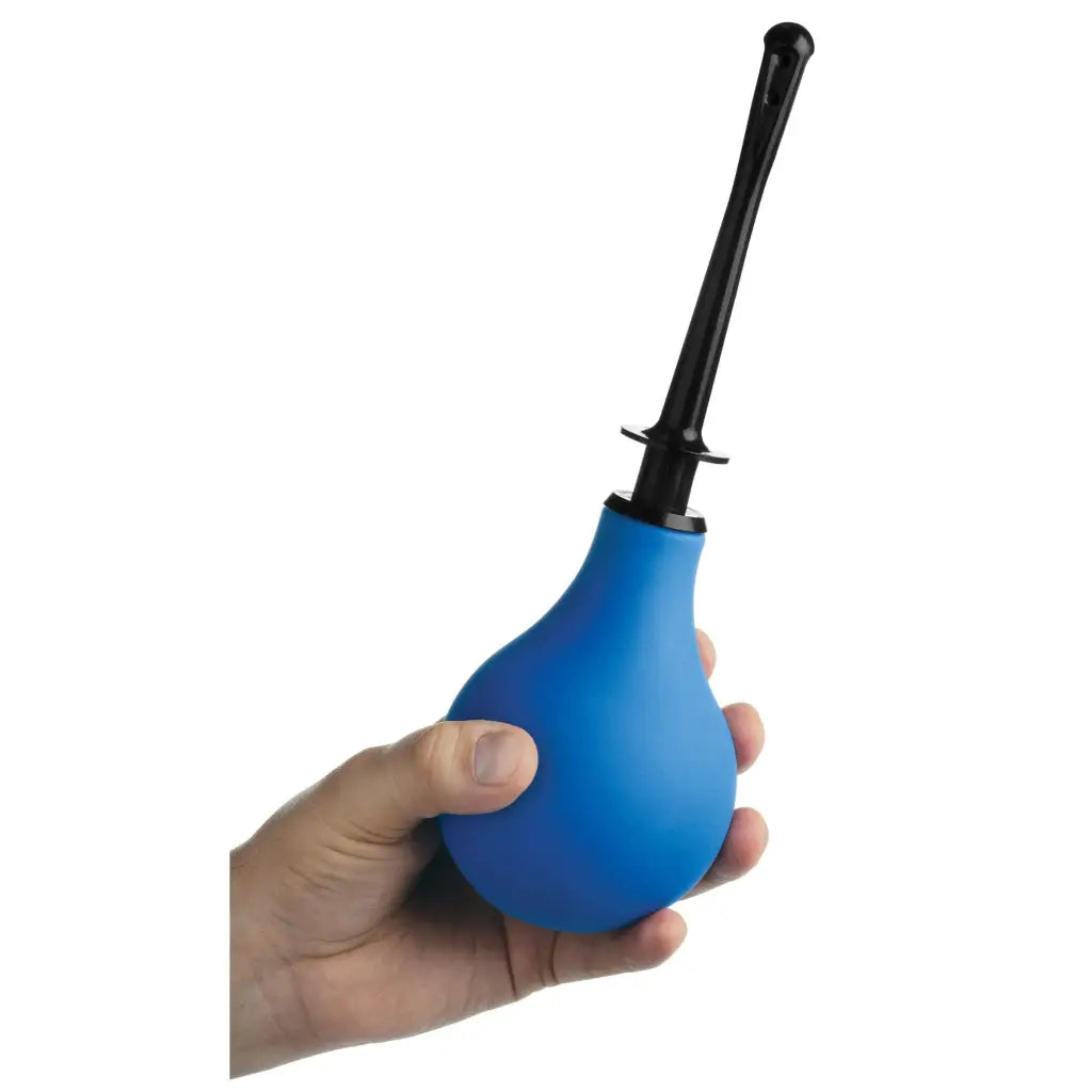 A hand holding a blue plastic bottle with black handle from Premium One-way Valve Anal Douche Set