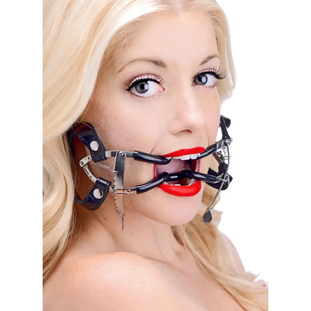 A woman wearing a Ratchet Style Jennings Mouth Gag With Strap for secure oral restraint