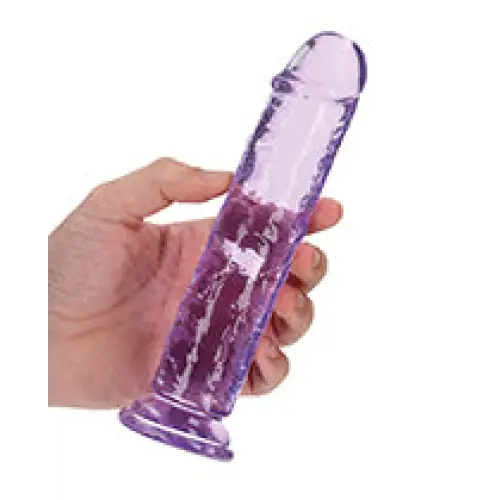 A hand holding a purple RealRock Crystal Clear Straight 7 in. Dildo Without Balls