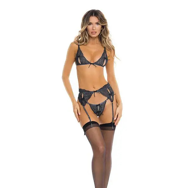 Woman wearing Rene Rofe Sneak Peak Bra, garter belt, and stockings in black lace lingerie set