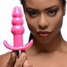 Frisky Powered Plug Pink Ribbed Vibrating Butt Plug at the Haus of Shag