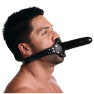 Man wearing Ride Me Mouth Gag, showcasing black muzzle with inch insertable length