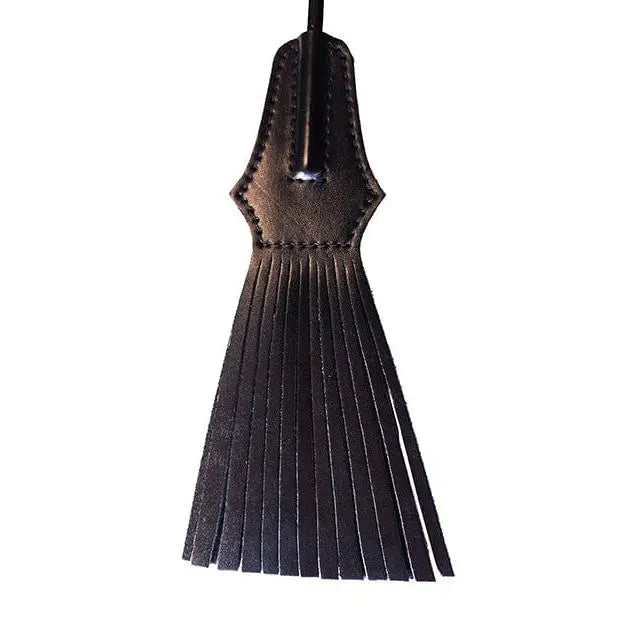 Leather pendant on Rouge Tasselled Riding Crop - Black, featuring a stylish fringe top