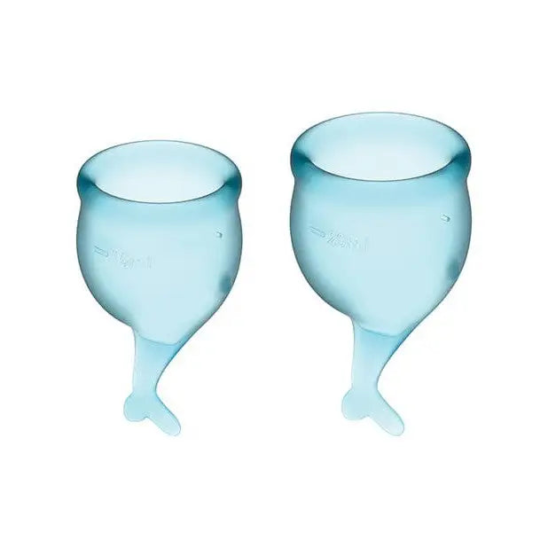 Two blue wine glasses with Satisfyer Feel Secure Menstrual Cup on a white background