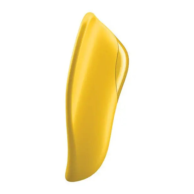 Yellow nail with white background holding Satisfyer High Fly Finger Vibrator