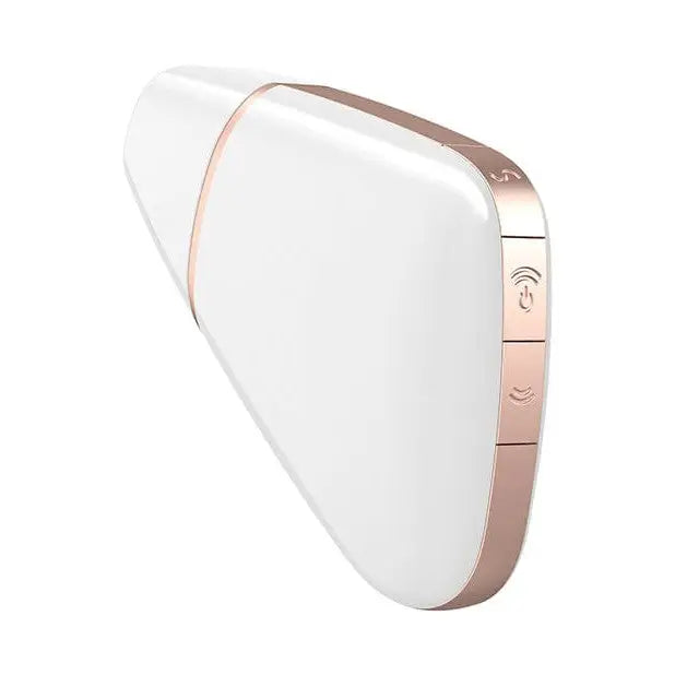 The back of a white and gold Satisfyer Love Triangle wireless device