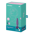 Box of Satisfyer Plug-ilicious 1 with a purple plug and a man’s face illustration