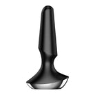 A black and white image of a spoon beside the Satisfyer Plug-ilicious 2 product