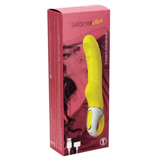 Close-up of yellow and pink Satisfyer Vibes Yummy Sunshine sex toy in packaging