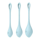 Three pale blue cooking spoons accompany the Satisfyer Yoni Power 2 Balls Training Set