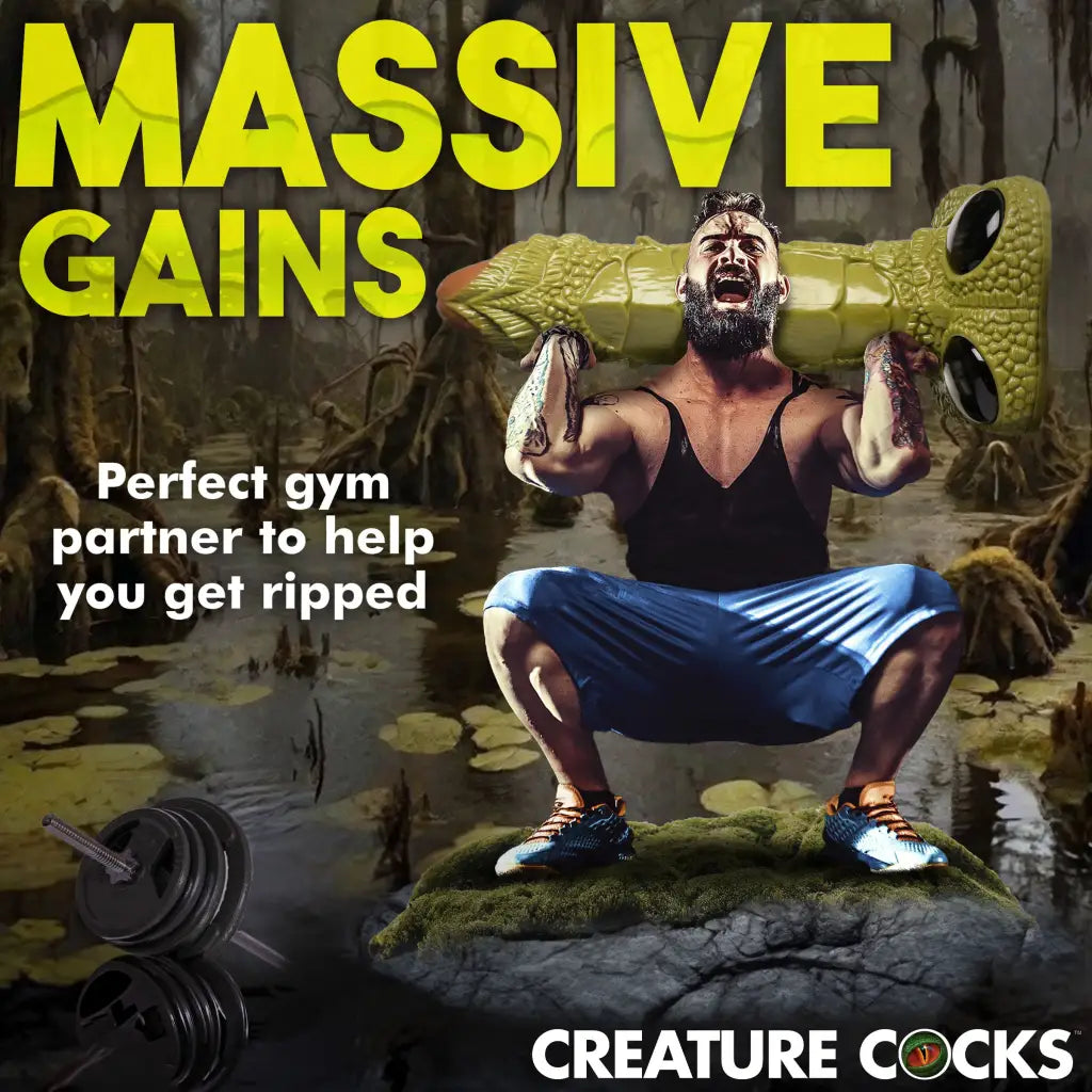 Muscular man lifting inflatable alligator with the Scaly Swamp Monster 3 Foot Dildo, suction cup