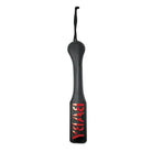 Sex & Mischief Baby Paddle - Black leather paddle with ’YEAH!’ in red and yellow lettering