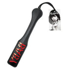 Sex & Mischief Baby Paddle: Black leather paddle with red ’BAD’ text on the handle