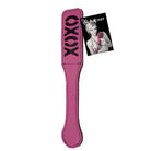 Mischief Xoxo Paddle: Pink paddle-shaped object with ‘OXOX’ on it