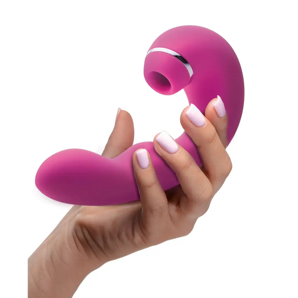 ’Shegasm Star 10x Tapping G-spot Silicone Vibrator held by manicured hand’