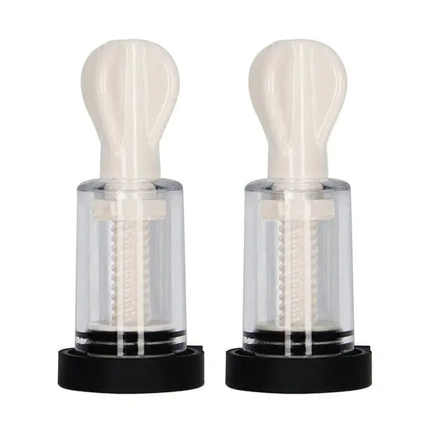 Pair of Shots Electroshock Nipple Suckers with clear cylinders and white bulb tops