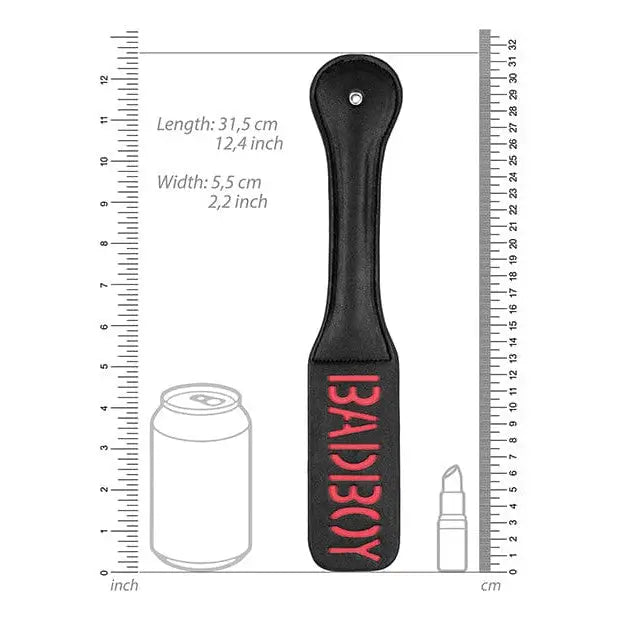 Black paddle-shaped BAD BOY paddle by Shots Ouch Bad Boy with red text