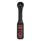 Shots Ouch Bitch Paddle - Black leather paddle with ’BITCH’ in red lettering