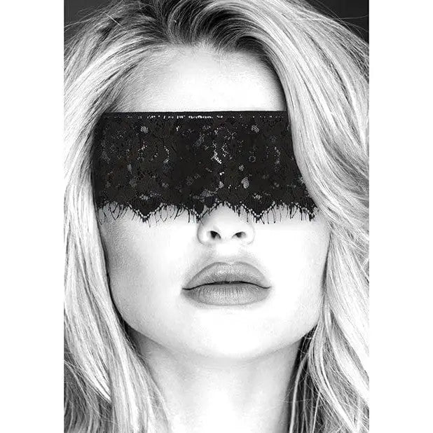 Blonde woman wearing Shots Ouch Black & White lace mask w/ elastic straps, eyes covered