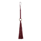 Burgundy leather tassel keychain, also a stylish bag charm from Shots Ouch Halo Flogger