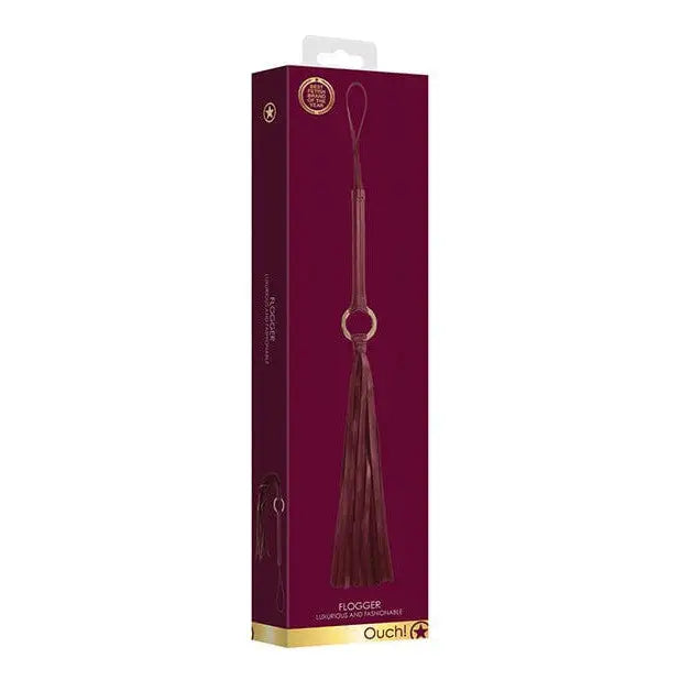 Burgundy leather Shots Ouch Halo Flogger in retail packaging for discrete shopping needs