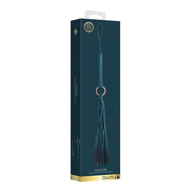 Teal-colored Shots Ouch Halo Flogger with loop handle, packaged in a retail box