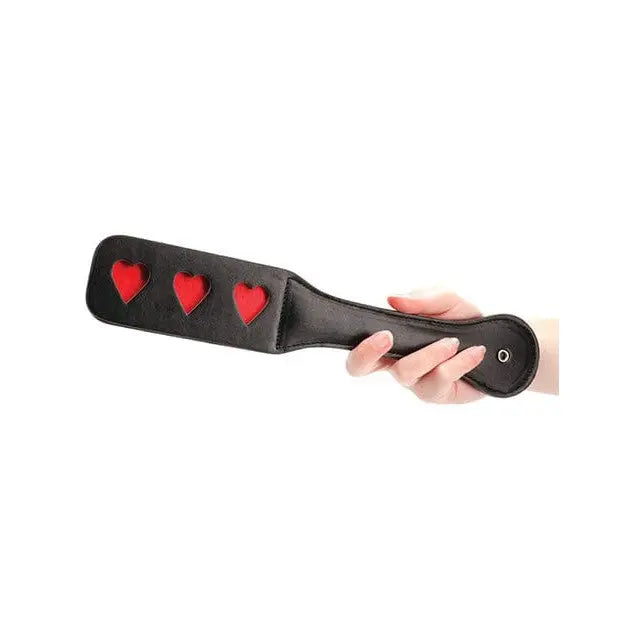 Black leather Shots Ouch Hearts Paddle with three red heart-shaped cutouts - elegant and bold