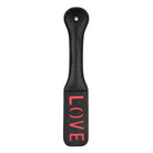 Black leather Shots Ouch Love Paddle with red ’LOVE’ lettering on the surface