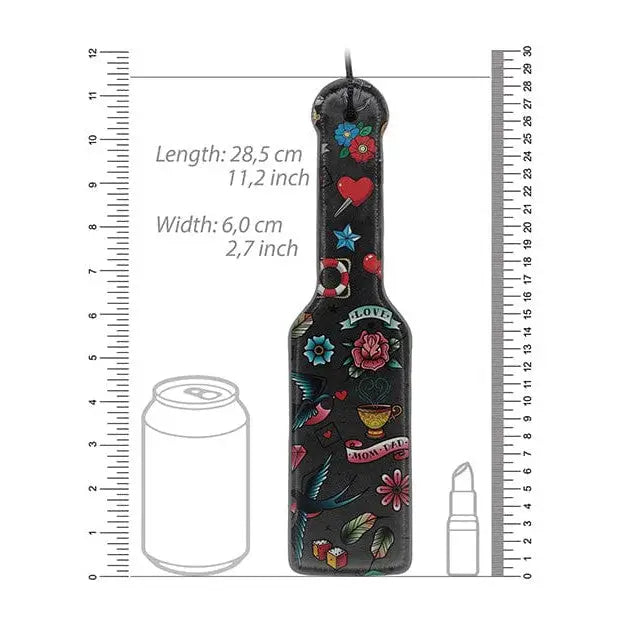 School tattoo style printed paddle with colorful floral and symbolic designs on black