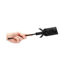 Hand holding a black lace Shots Ouch Rectangle Crop with ribbon handle