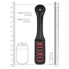 Black shots ouch xoxo paddle with ’XOXO’ text on its surface for playful adventures