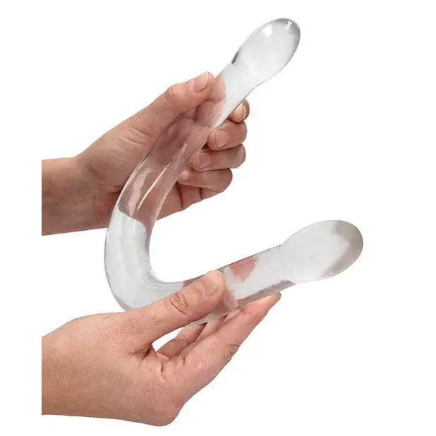 Person holding Shots Realrock Crystal Clear 17’ Double Dildo with curved transparent design